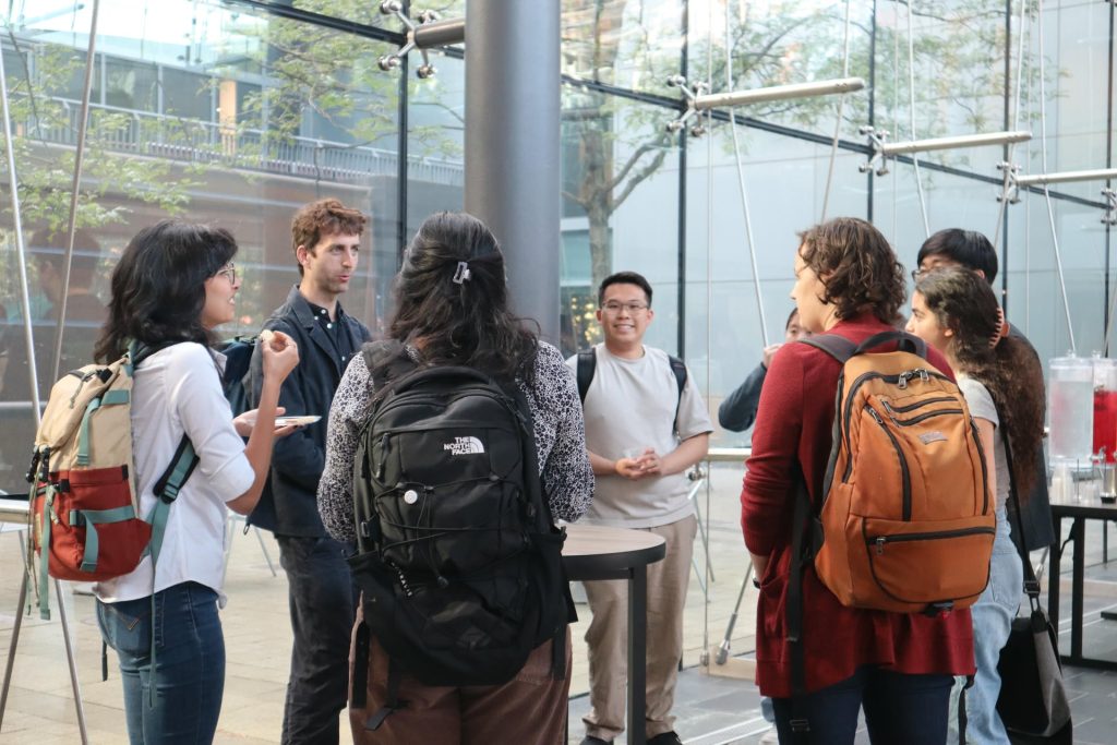 symposium attendees gather after the event